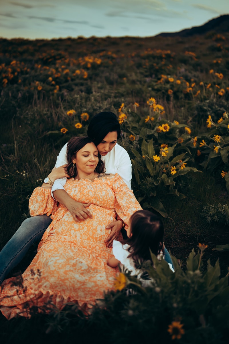Portland Family Photographer, couple sitting in a flower field