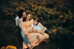 Portland Family Photographer, family sitting together in flowers
