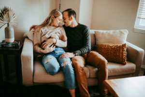 mother and father holding newborn during their newborn session in portland oregon