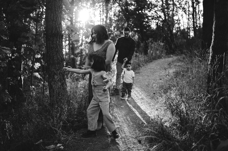 family of four walking around forest in lake oswego