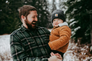dad smiling at toddler in Mt Hood