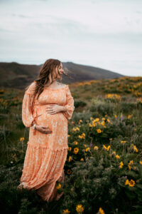 pregnant woman being photographed during maternity session at the Columbia River Gorge