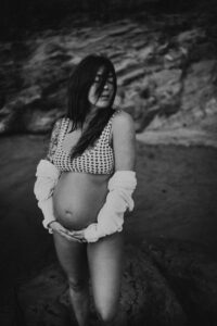 pregnant woman during maternity session at Oregon Coast