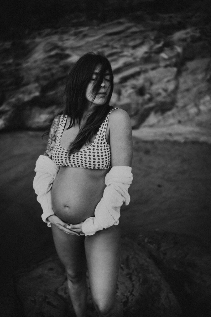 pregnant woman during maternity session at Oregon Coast