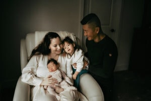 family with a newborn baby at home